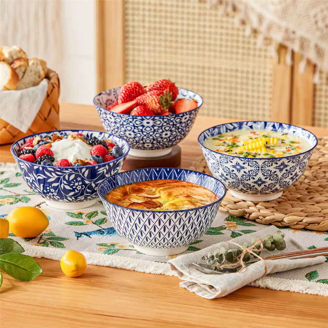 Selene stoneware cereal bowls set of 4 with berry yogurt ice cream, soup and linen napkins on botanical table runner.